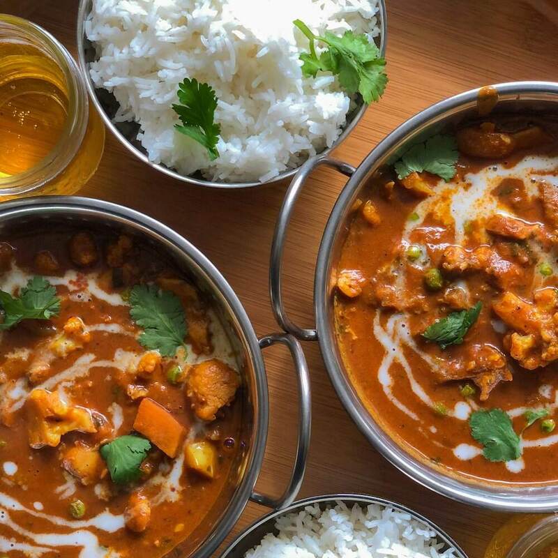 An assortment of South Indian curries in bowls with rice, like a week of the curry subscription